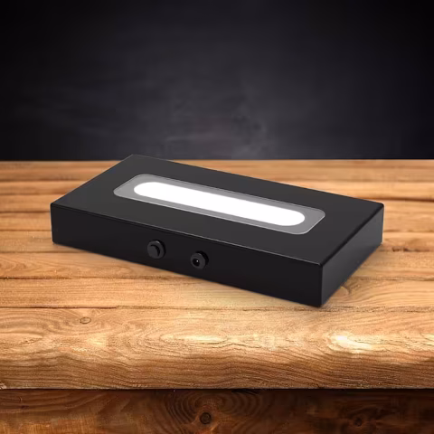 Wood LED light base with a dark background