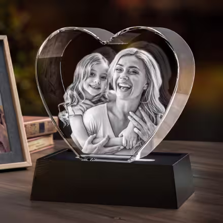 A beautiful family picture engraved in a 3D photo gem crystal heart with a LED light base.